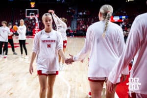 Nebraska Cornhuskers guard Alberte Rimdal (5) gives five to forward Jessica Petrie (12) beofre taking on the Michigan Wolverines during a college women’s basketball game on Wednesday, February 6, 2025 in Lincoln, Nebraska. Photo by John S. Peterson.