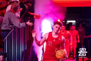 Nebraska Cornhusker guard Connor Essegian (0) leads the Huskers out to take on the Ohio State Buckeye during a college men’s basketball game on Sunday, February 9, 2025, in Lincoln, Nebraska. Photo by John S. Peterson.