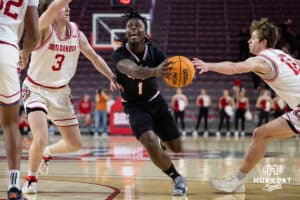 Omaha Mavericks guard JJ White (1) drives to the basket against South Dakota Coyotes guard Max Burchill (3) in the first half during a college basketball game, Wednesday, January 29, 2025, in Vermillion, South Dakota. Photo by John S. Peterson.