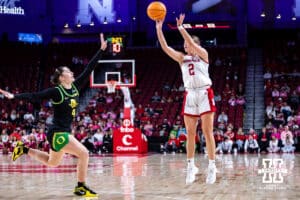 Nebraska Cornhusker guard Logan Nissley (2) makes a threepoint shot against Oregon Duck guard Nani Falatea (4) in the first quarter during a college women’s basketball game Wednesday, February 19, 2025 in Lincoln, Nebraska. Photo by John S. Peterson.