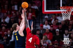 Nebraska Cornhusker forward Juwan Gary (4) tries to block Michigan Wolverine center Danny Wolf (1) in the first half during a college men’s basketball game Monday, February 24, 2025 in Lincoln, Nebraska. Photo by John S. Peterson.