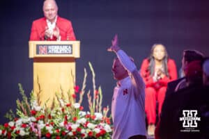 Retiring Nebraska volleyball coach John Cook waves to the crowd during the Welcome to Dani Busboom-Kelly Celebration event Thursday, February 6, 2025 in Lincoln, Nebraska. Photo by John S. Peterson.