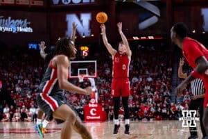 Nebraska Cornhusker guard Connor Essegian (0) makes a three-pooint shot against the Ohio State Buckeyes in the first half during a college men’s basketball game on Sunday, February 9, 2025, in Lincoln, Nebraska. Photo by John S. Peterson.