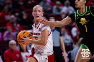 Nebraska Cornhusker guard Alberte Rimdal (5) drives to the basket against Oregon Duck forward Alexis Whitfield (1) in the second quarter during a college women’s basketball game Wednesday, February 19, 2025 in Lincoln, Nebraska. Photo by John S. Peterson.