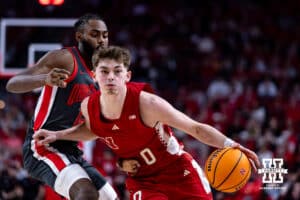 Nebraska Cornhusker guard Connor Essegian (0) dribbles the ball against Ohio State Buckeye guard Evan Mahaffey (12) in the first half during a college men’s basketball game on Sunday, February 9, 2025, in Lincoln, Nebraska. Photo by John S. Peterson.