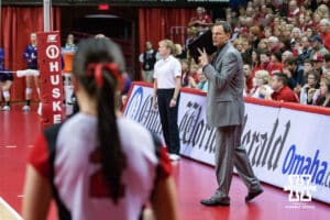 November 24, 2012: John Cook the head coach of the Nebraska Cornhuskers signals daughter and player Lauren Cook during the game against the Northern Wildcats in the last regular season to be played at the NU Coliseum in Lincoln, Nebraska. Nebraska defeated Northwestern 3 sets to 1. Photo by John S. Peterson.