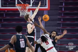 Omaha Mavericks forward Joshua Streit (23) and Kamryn Thomas breaks up a layup against South Dakota Coyotes guard Chase Forte (9) in the first half during a college basketball game, Wednesday, January 29, 2025, in Vermillion, South Dakota. Photo by John S. Peterson.