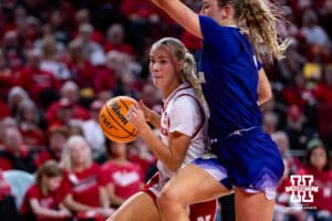 Nebraska Cornhusker guard Alberte Rimdal (5) dribbles the ball against Washington Huskies guard Devin Coppinger (3) in the first half during a college women’s basketball game Sunday, February 23, 2025 in Lincoln, Nebraska. Photo by John S. Peterson.