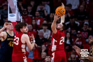 Nebraska Cornhusker guard Rollie Worster (24) reaches for a rebound against the Michigan Wolverines in the first half during a college men’s basketball game Monday, February 24, 2025 in Lincoln, Nebraska. Photo by John S. Peterson.