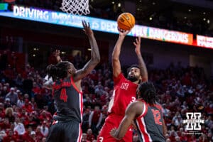 Nebraska Cornhusker guard Brice Williams (3) makes a basket against Ohio State Buckeye forward Aaron Bradshaw (4) and guard Evan Mahaffey (12) in the first half during a college men’s basketball game on Sunday, February 9, 2025, in Lincoln, Nebraska. Photo by John S. Peterson.