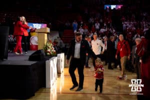 The Busboom-Kelly family makes their way to the stage during the Welcome to Dani Busboom-Kelly Celebration event Thursday, February 6, 2025 in Lincoln, Nebraska. Photo by John S. Peterson.