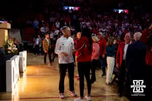 Retiring coach John Cook talks to Harper Murray after the Welcome to Dani Busboom-Kelly Celebration event Thursday, February 6, 2025 in Lincoln, Nebraska. Photo by John S. Peterson.