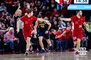 Nebraska Cornhusker guard Sam Hoiberg (1) and guard Rollie Worster (24) celebrates a three-point shot by Hoiberg against the Michigan Wolverines in the second half during a college men’s basketball game Monday, February 24, 2025 in Lincoln, Nebraska. Photo by John S. Peterson.