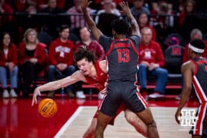 Nebraska Cornhusker center Braxton Meah (34) reaches for the ball against Ohio State Buckeye forward Sean Stewart (13) in the first half during a college men’s basketball game on Sunday, February 9, 2025, in Lincoln, Nebraska. Photo by John S. Peterson.