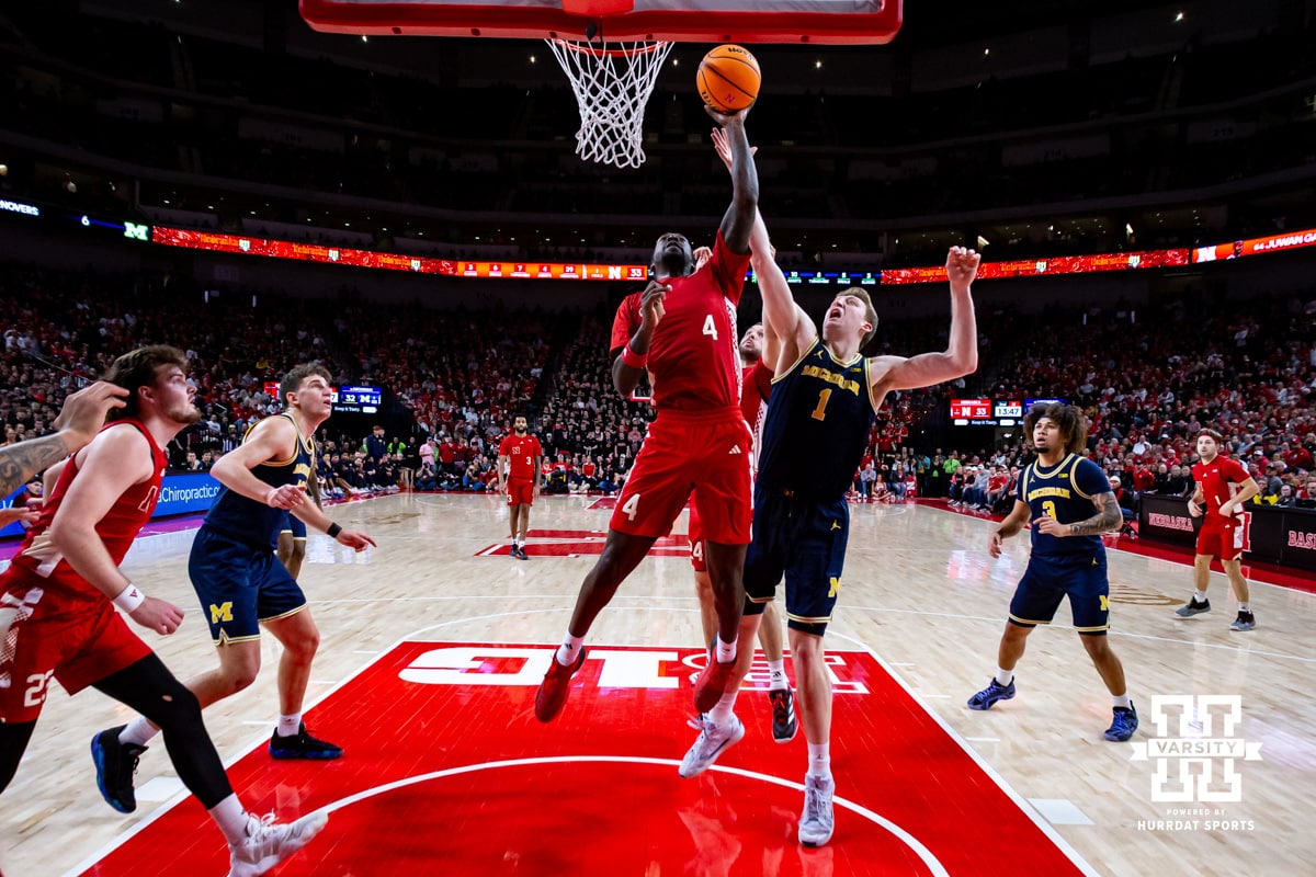 Nebraska Cornhusker forward Juwan Gary (4) makes a layup in the second half against Michigan Wolverine center Danny Wolf (1) during a college men’s basketball game Monday, February 24, 2025 in Lincoln, Nebraska. Photo by John S. Peterson.