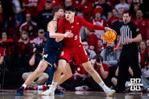 Nebraska Cornhusker forward Berke Buyuktuncel (9) drives to the basket against Michigan Wolverine forward Will Tschetter (42) in the second half during a college men’s basketball game Monday, February 24, 2025 in Lincoln, Nebraska. Photo by John S. Peterson.