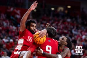 Nebraska Cornhusker guard Brice Williams (3) grabs the rebound colliding with Connor Essegian and against Ohio State Buckeye guard Bruce Thornton (2) in the second half during a college men’s basketball game on Sunday, February 9, 2025, in Lincoln, Nebraska. Photo by John S. Peterson.