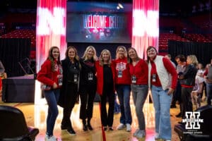 Dani Busboom-Kelly poses for a photo with former teammates during the Welcome to Dani Busboom-Kelly Celebration event Thursday, February 6, 2025 in Lincoln, Nebraska. Photo by John S. Peterson.