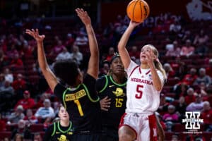 Nebraska Cornhusker guard Alberte Rimdal (5) makes a layup against Oregon Duck forward Alexis Whitfield (1) in the fourth quarter during a college women’s basketball game Wednesday, February 19, 2025 in Lincoln, Nebraska. Photo by John S. Peterson.