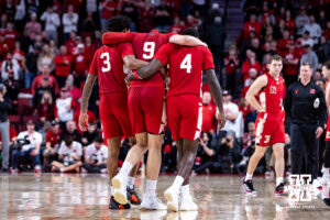 Nebraska Cornhusker forward Berke Buyuktuncel (9) helped off the court by Brice Williams and Juwan Gary after an injury during a college men’s basketball game against the Ohio State Buckeyes on Sunday, February 9, 2025, in Lincoln, Nebraska. Photo by John S. Peterson.