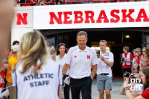 Nebraska Cornhusker head coach John Cook walks out to the court beofre taking on Omaha during Nebraska Volleyball Day match in Lincoln, Nebraska, Wednesday, August 30, 2023. Photo by John Peterson.