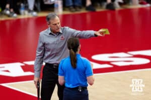 Nebraska Cornhusker head coach John Cook challenges a call during a college volleyball match against the Wisconsin Badgers Saturday, November 23, 2024 in Lincoln, Nebraska. Photo by John S. Peterson.