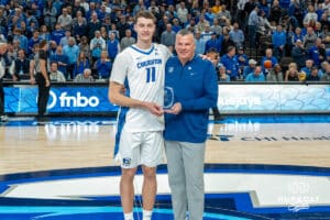 Creighton Bluejays Ryan Kalkbrenner is honored before the Marquette game for his career accomplishment of over 1,000 rebounds on February 8th, 2025 in Omaha, Nebraska. Photo by Brandon Tiedemann.