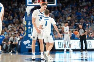 Creighton Bluejays Ryan Kalkbrenner and Steven Ashworth talk during a college basketball game against Marquette on February 8th, 2025 in Omaha, Nebraska. Photo by Brandon Tiedemann.