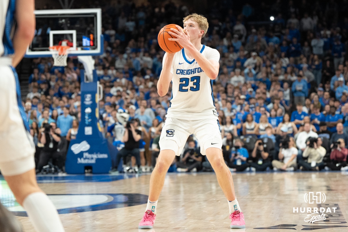 Creighton Bluejays Jackson McAndrew attempts a three during a college basketball game against Marquette on February 8th, 2025 in Omaha, Nebraska. Photo by Brandon Tiedemann.