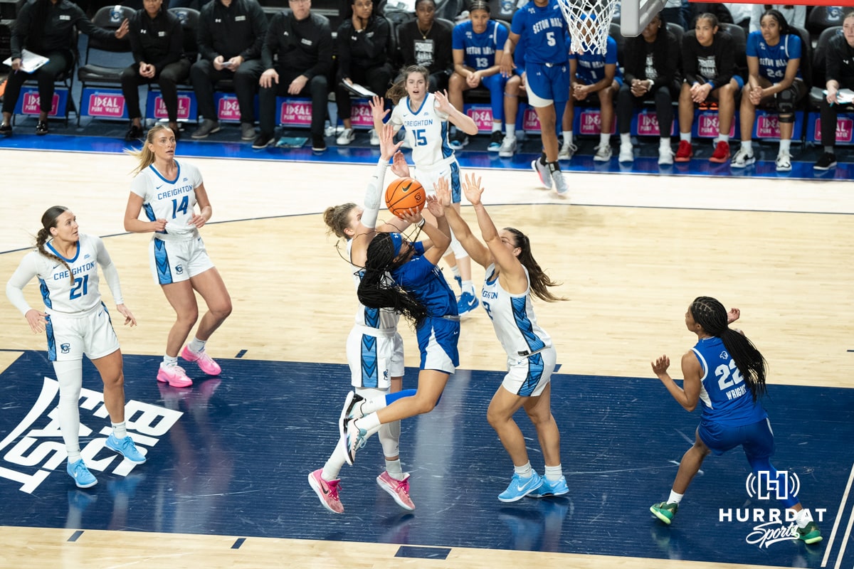 Creighton Bluejays Morgan Maly and Kennedy Townsend contest a layup during a college basketball game against Seton Hall on February 5th, 2025 in Omaha Nebraska. Photo by Brandon Tiedemann.