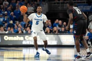 Creighton Bluejays Jamiya Neal looks to pass during a college basketball game against UCONN on February 11th, 2025 in Omaha Nebraska. Photo by Brandon Tiedemann.