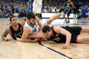 Creighton Bluejays Fedor Žugić fights for a loose ball during a college basketball game against UCONN on February 11th, 2025 in Omaha Nebraska. Photo by Brandon Tiedemann.