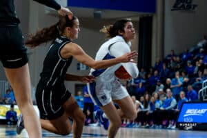 Creighton Bluejay Kiani Lockett protects the ball on a drive during a basketball game against the Providence Friars at Sokol Arena on Saturday, January 18, 2025, in Omaha, Nebraska. Photo by Collin Stilen.