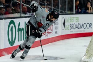 Omaha Maverick Zach Urdahl with the puck moving it out of the defense during a hockey match at Baxter Arena on Saturday, February 2, 2025, in Omaha, Nebraska. Photo by Collin Stilen.