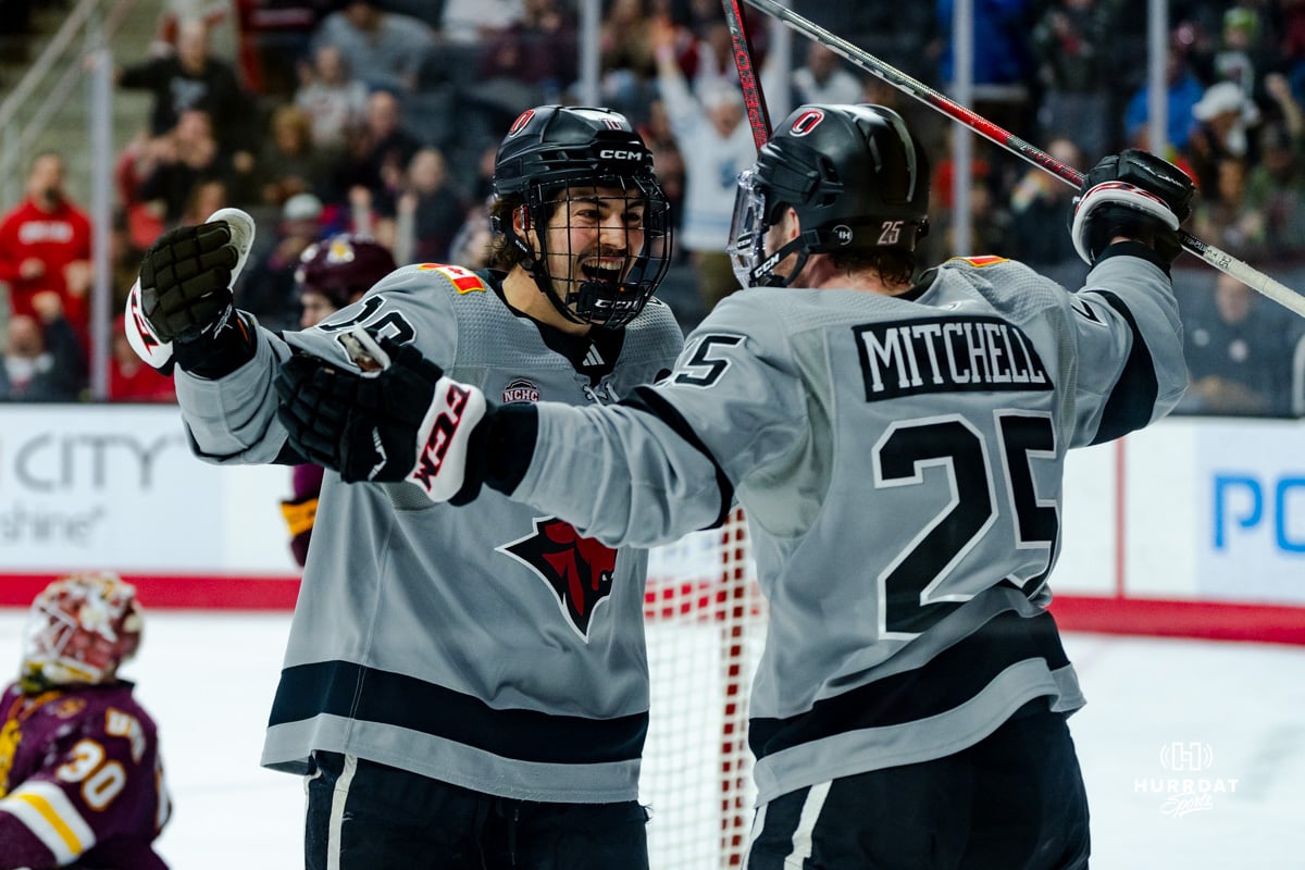 Omaha Maverick Jacob Guevin celebrates his goal with Cam Mitchell during a hockey match at Baxter Arena on Saturday, February 2, 2025, in Omaha, Nebraska. Photo by Collin Stilen.