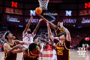 Minnesota Golden Gopher forward Frank Mitchell (00) reaches for the rebound against Nebraska Cornhusker guard Brice Williams (3) in the first half during a men’s college basketball game Saturday, March 1, 2025 in Lincoln, Nebraska. Photo by John S. Peterson.