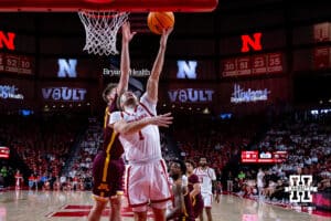 Nebraska Cornhusker guard Sam Hoiberg (1) makes a lay up against Minnesota Golden Gopher guard Brennan Rigsby (24) in the first half during a men’s college basketball game Saturday, March 1, 2025 in Lincoln, Nebraska. Photo by John S. Peterson.