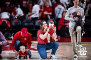 Parents getting their babies lined up for the Baby Race at halftime during a men’s college basketball game between the Nebraska Cornhusker and the Minnesota Golden Gophers Saturday, March 1, 2025 in Lincoln, Nebraska. Photo by John S. Peterson.