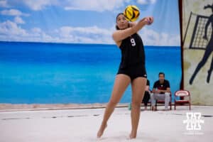 Nebraska Cornhusker Teraya Sigler (9) passes the ball against the Ottawa Braves during a college beach volleyball match Tuesday, March 4, 2025 in Lincoln, Nebraska. Photo by John S. Peterson.