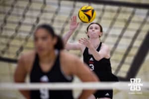 Nebraska Cornhusker Bergen Reilly (3) serves the ball against the Ottawa Braves during a college beach volleyball match Tuesday, March 4, 2025 in Lincoln, Nebraska. Photo by John S. Peterson.