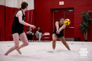 Nebraska Cornhusker Teraya Sigler (9) passes the ball against the Ottawa Braves during a college beach volleyball match Tuesday, March 4, 2025 in Lincoln, Nebraska. Photo by John S. Peterson.