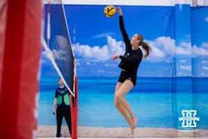 Nebraska Cornhusker Andi Jackson (11) spikes theball against the Ottawa Braves during a college beach volleyball match Tuesday, March 4, 2025 in Lincoln, Nebraska. Photo by John S. Peterson.