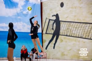 Nebraska Cornhusker Andi Jackson (11) serves the ball against the Ottawa Braves during a college beach volleyball match Tuesday, March 4, 2025 in Lincoln, Nebraska. Photo by John S. Peterson.