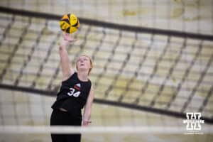 Nebraska Cornhusker Olivia Mauch (34) serves the ball against the Ottawa Braves during a college beach volleyball match Tuesday, March 4, 2025 in Lincoln, Nebraska. Photo by John S. Peterson.