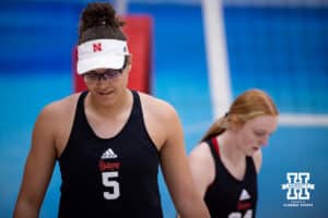 Nebraska Cornhusker Rebekah Allick (5) walks back to prepare to serve the ball against the Ottawa Braves during a college beach volleyball match Tuesday, March 4, 2025 in Lincoln, Nebraska. Photo by John S. Peterson.