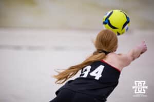 Nebraska Cornhusker Olivia Mauch (34) lunges forward to dig the ball against the Ottawa Braves during a college beach volleyball match Tuesday, March 4, 2025 in Lincoln, Nebraska. Photo by John S. Peterson.