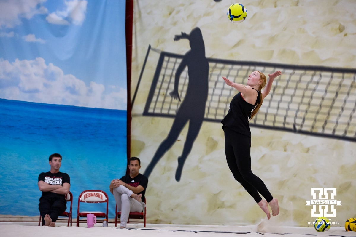 Nebraska Cornhusker Olivia Mauch (34) serves the ball against the Ottawa Braves during a college beach volleyball match Tuesday, March 4, 2025 in Lincoln, Nebraska. Photo by John S. Peterson.