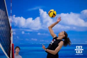 Nebraska Cornhusker Skyler Pierce (23) spikes the ball against the Ottawa Braves during a college beach volleyball match Tuesday, March 4, 2025 in Lincoln, Nebraska. Photo by John S. Peterson.