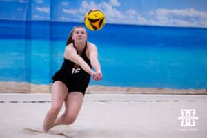 Nebraska Cornhusker Campbell Flynn (16) digs the ball against the Ottawa Braves during a college beach volleyball match Tuesday, March 4, 2025 in Lincoln, Nebraska. Photo by John S. Peterson.