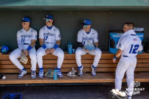 Creighton Bluejay infielder Ben North (11), Will MacLean (17), Nolan Sailors (1), and Nick Venteicher (12) hanging out in the dugout before taking on the Xavier Musketeers during a college baseball game on Sunday, May 11, 2025 in Omaha, Nebraska. Photo by John S. Peterson.